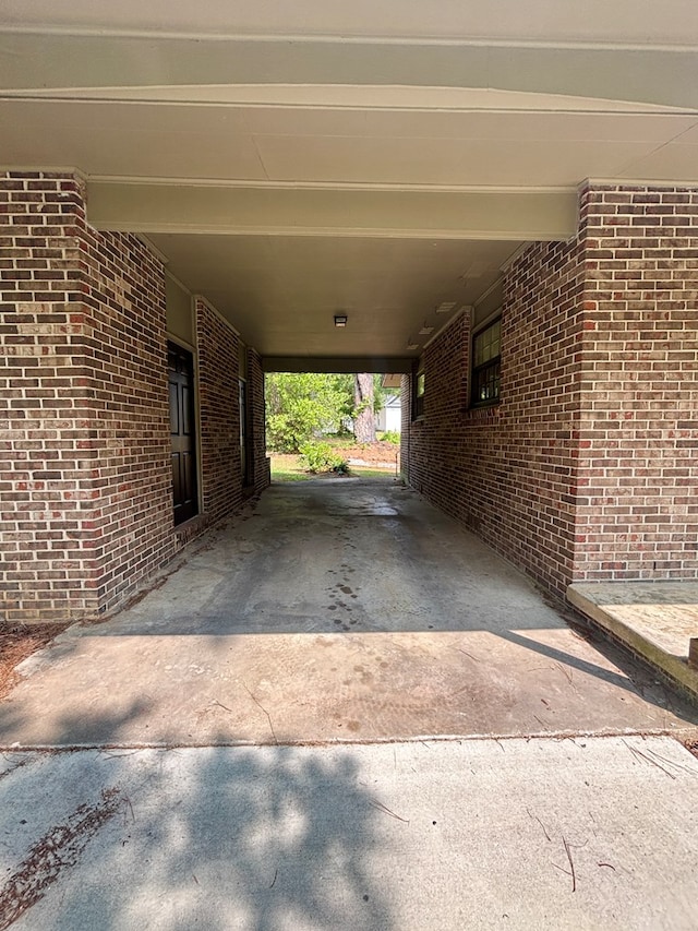 2203 Stonebridge Rd, Dothan, AL 36301 - view of patio / terrace featuring a carport and concrete driveway