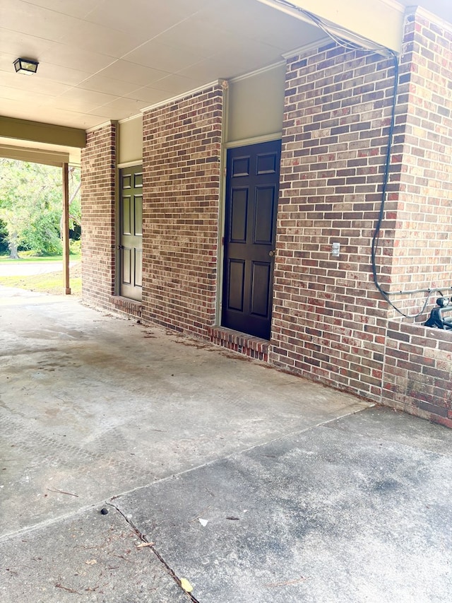 2203 Stonebridge Rd, Dothan, AL 36301 - view of exterior entry with brick siding and an attached carport