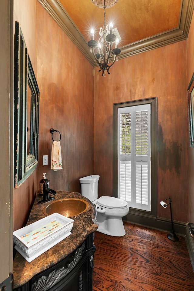 203 Liveoak Trl, Dothan, AL 36305 - bathroom featuring toilet, ornamental molding, a chandelier, vanity, and wood finished floors