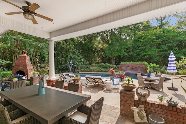203 Liveoak Trl, Dothan, AL 36305 - view of patio / terrace with outdoor dining space, ceiling fan, an outdoor brick fireplace, and an outdoor pool