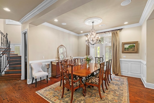 203 Liveoak Trl, Dothan, AL 36305 - dining room with stairs, wood finished floors, a wainscoted wall, a chandelier, and crown molding