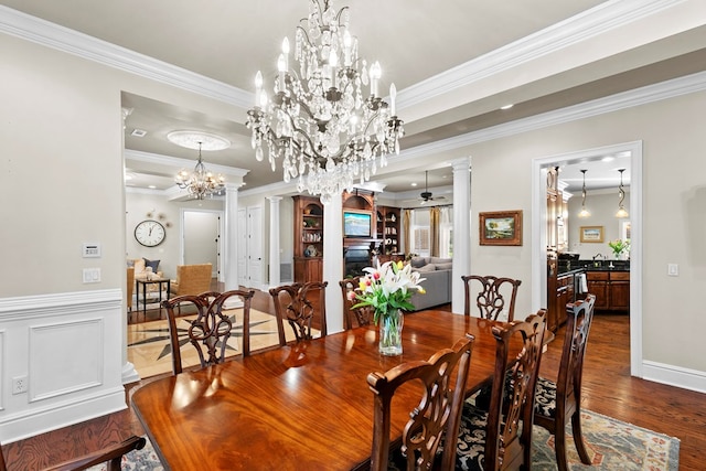 203 Liveoak Trl, Dothan, AL 36305 - dining space with ornamental molding, wood finished floors, a chandelier, decorative columns, and baseboards