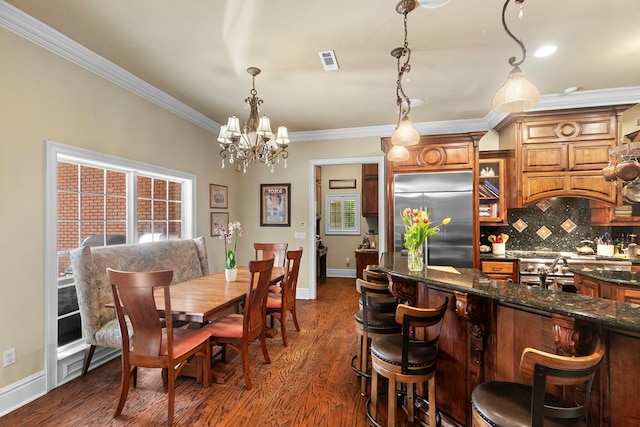 203 Liveoak Trl, Dothan, AL 36305 - dining space with ornamental molding, a chandelier, baseboards, and dark wood finished floors