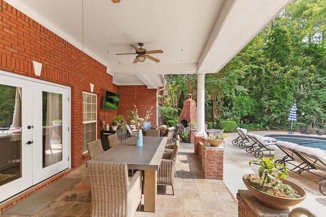 203 Liveoak Trl, Dothan, AL 36305 - view of patio featuring ceiling fan, french doors, an outdoor pool, and outdoor dining area