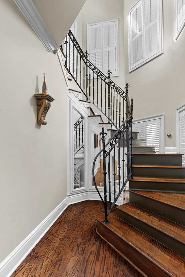 203 Liveoak Trl, Dothan, AL 36305 - staircase with a high ceiling, wood finished floors, and baseboards