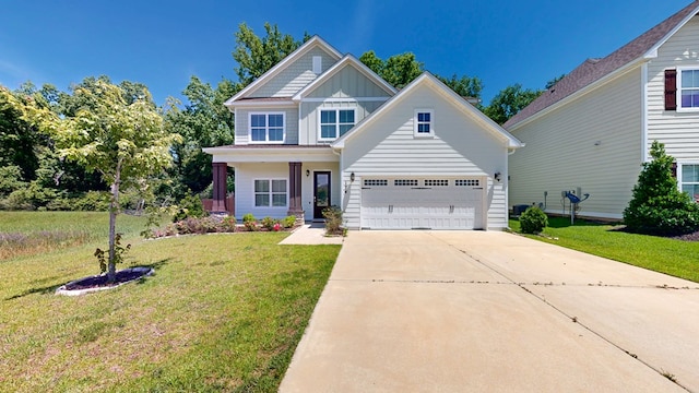 174 Ridgecrest Loop, Dothan, AL 36301 - view of front of property with board and batten siding, concrete driveway, and a front lawn