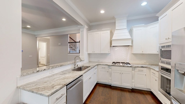 174 Ridgecrest Loop, Dothan, AL 36301 - kitchen with a sink, stainless steel appliances, custom range hood, ornamental molding, and decorative backsplash