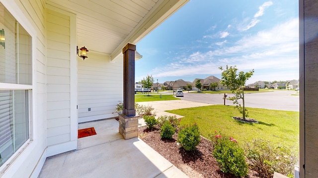 174 Ridgecrest Loop, Dothan, AL 36301 - covered porch featuring a residential view and a yard