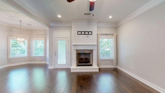 174 Ridgecrest Loop, Dothan, AL 36301 - unfurnished living room with a fireplace, dark wood-style floors, a ceiling fan, a chandelier, and ornamental molding
