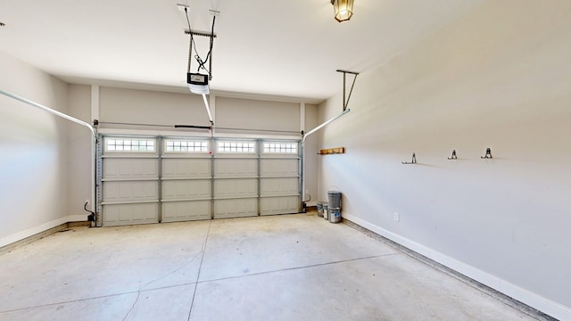 174 Ridgecrest Loop, Dothan, AL 36301 - garage featuring a garage door opener and baseboards