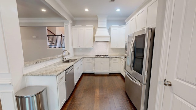 174 Ridgecrest Loop, Dothan, AL 36301 - kitchen featuring appliances with stainless steel finishes, a sink, custom exhaust hood, crown molding, and white cabinets
