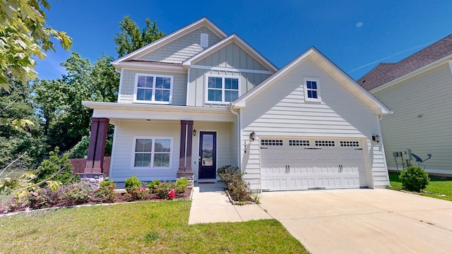 174 Ridgecrest Loop, Dothan, AL 36301 - view of front of house with board and batten siding, concrete driveway, a front yard, and a porch