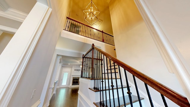 174 Ridgecrest Loop, Dothan, AL 36301 - stairs with a chandelier, crown molding, and wood-type flooring