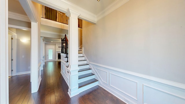 174 Ridgecrest Loop, Dothan, AL 36301 - stairway featuring ornamental molding, wood finished floors, wainscoting, and a decorative wall