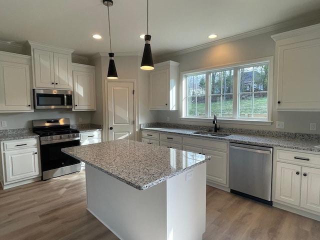 kitchen with appliances with stainless steel finishes and white cabinets