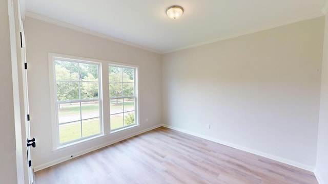 28 Memory Ln, Eufaula, AL 36027 - empty room featuring light wood-style flooring, baseboards, and crown molding