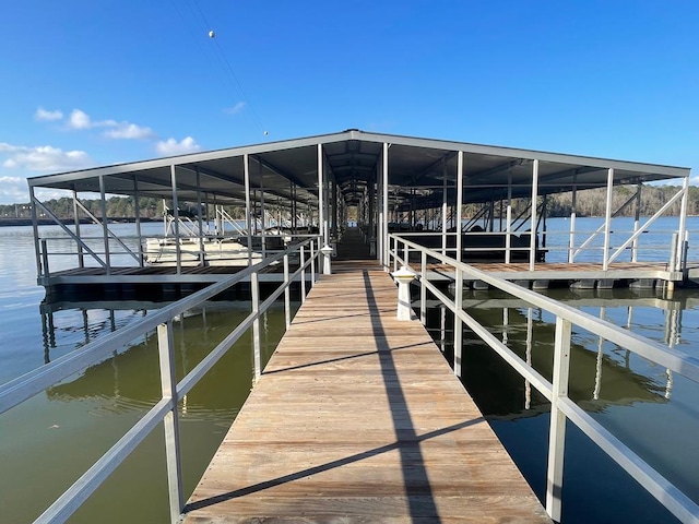 dock area featuring a water view