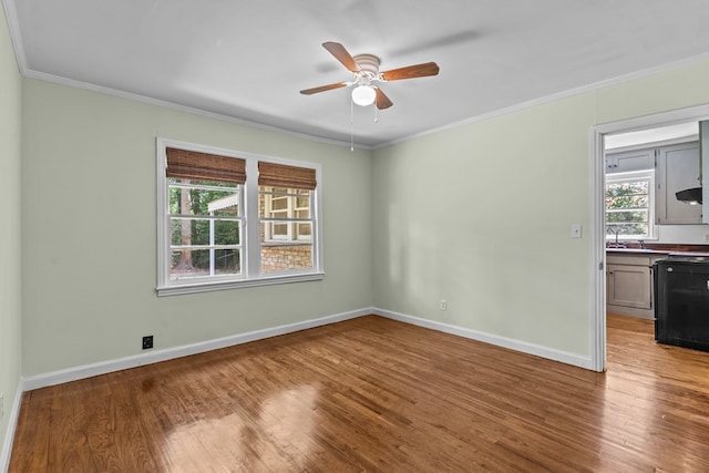 700 S Lakeview, Dothan, AL 36301 - empty room with ceiling fan, wood finished floors, ornamental molding, and baseboards