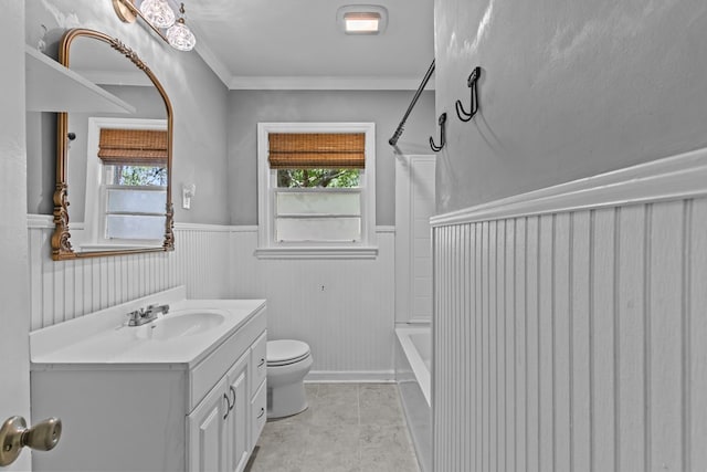 700 S Lakeview, Dothan, AL 36301 - full bathroom featuring wainscoting, toilet, vanity, plenty of natural light, and ornamental molding