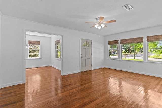 700 S Lakeview, Dothan, AL 36301 - empty room featuring ceiling fan, plenty of natural light, and wood finished floors