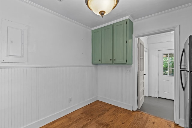 700 S Lakeview, Dothan, AL 36301 - clothes washing area featuring wood finished floors, crown molding, electric panel, and wainscoting