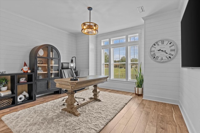 office featuring ornamental molding and light wood-type flooring