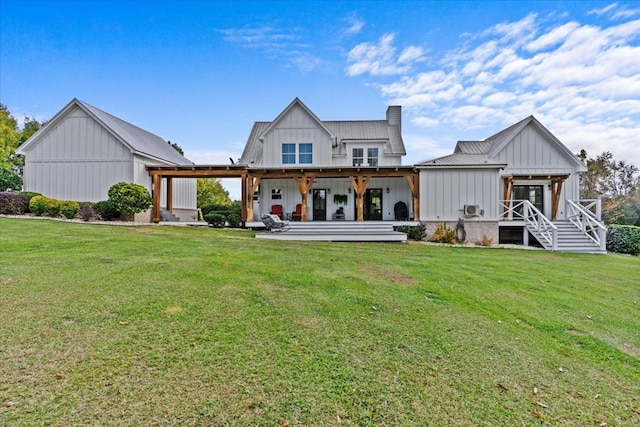 back of house featuring a lawn