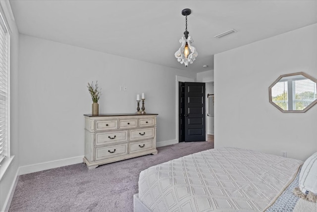 bedroom featuring light colored carpet