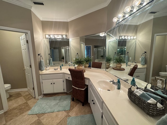 bathroom featuring a shower with door, vanity, ornamental molding, and toilet