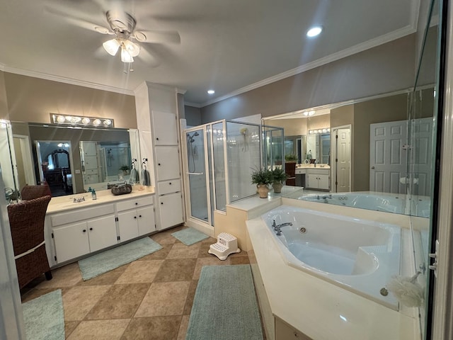 bathroom featuring ornamental molding, vanity, and independent shower and bath