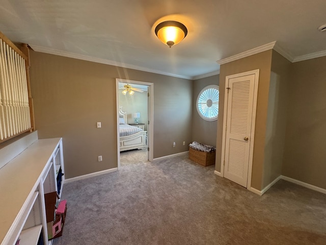 interior space with light colored carpet, ceiling fan, and ornamental molding