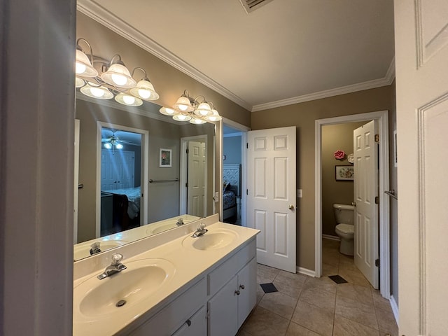 bathroom with an inviting chandelier, tile patterned floors, toilet, vanity, and ornamental molding