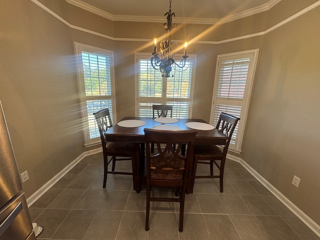 dining space with ornamental molding and a chandelier