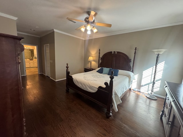 bedroom with ceiling fan, dark hardwood / wood-style flooring, crown molding, and connected bathroom