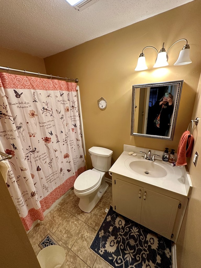 full bathroom featuring toilet, a textured ceiling, shower / tub combo, and vanity