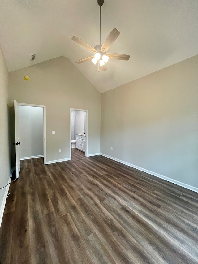 unfurnished bedroom featuring dark hardwood / wood-style floors, ceiling fan, and vaulted ceiling