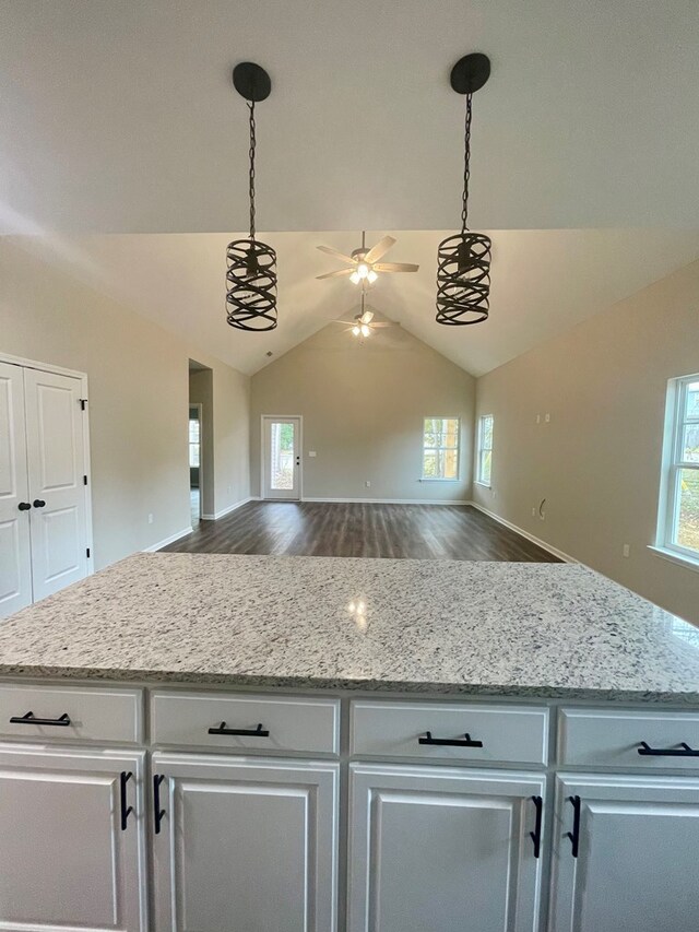 kitchen featuring white cabinets, dark wood-type flooring, ceiling fan, and lofted ceiling