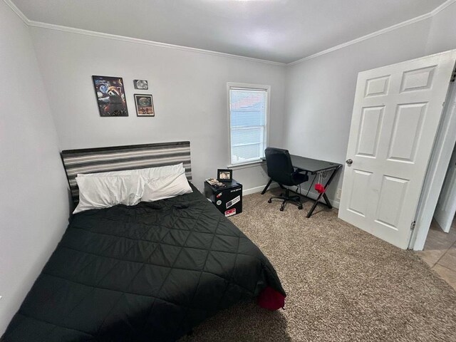 305 Highland Ave, Ozark, AL 36360 - carpeted bedroom with crown molding and baseboards