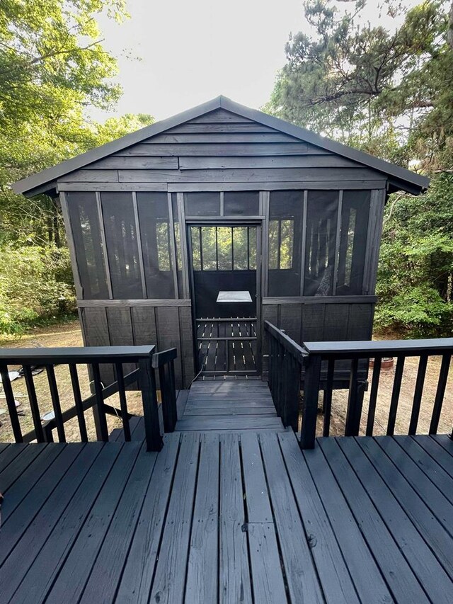 305 Highland Ave, Ozark, AL 36360 - wooden deck with a sunroom