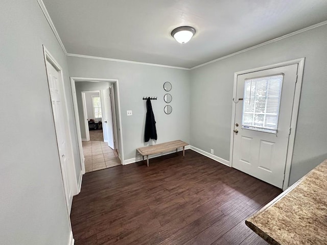 305 Highland Ave, Ozark, AL 36360 - foyer with ornamental molding, healthy amount of natural light, dark wood finished floors, and baseboards