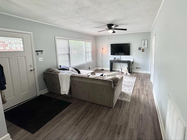 305 Highland Ave, Ozark, AL 36360 - living area with a ceiling fan, wood finished floors, a textured ceiling, ornamental molding, and baseboards