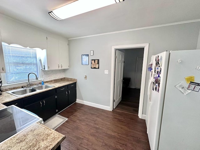 305 Highland Ave, Ozark, AL 36360 - kitchen featuring freestanding refrigerator, a sink, ornamental molding, dark wood-style flooring, and light countertops