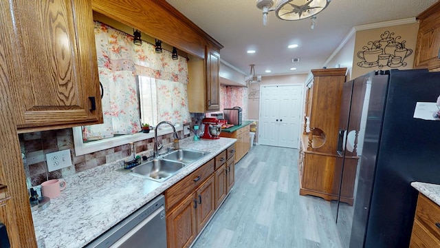 391 Hatton Rd, Dothan, AL 36301 - kitchen featuring refrigerator with ice dispenser, crown molding, light wood-style floors, light countertops, and brown cabinets
