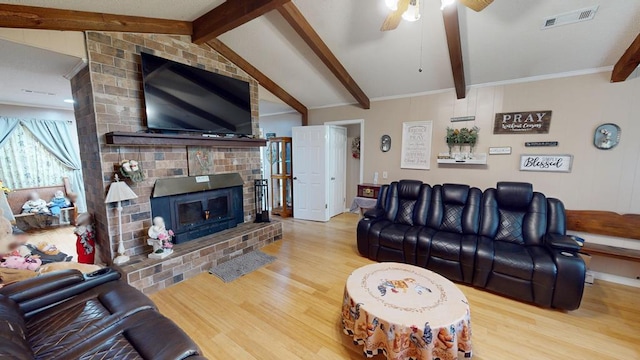 391 Hatton Rd, Dothan, AL 36301 - living room featuring wood finished floors, ceiling fan, and a fireplace