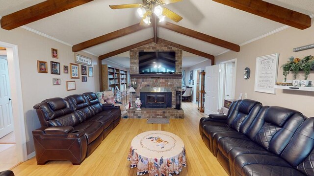 391 Hatton Rd, Dothan, AL 36301 - living area with wood finished floors, beamed ceiling, a ceiling fan, and a fireplace
