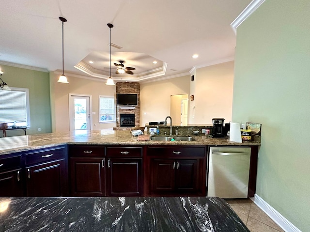 202 Frisco Ln, Enterprise, AL 36330 - kitchen with stainless steel dishwasher, a ceiling fan, a stone fireplace, light stone counters, and a sink