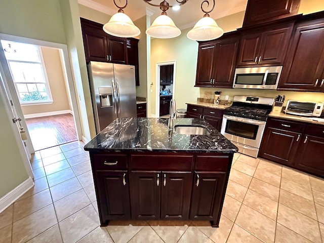 202 Frisco Ln, Enterprise, AL 36330 - kitchen featuring a toaster, baseboards, a sink, appliances with stainless steel finishes, and light tile patterned floors