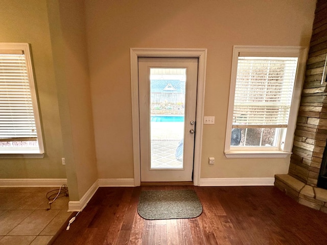 202 Frisco Ln, Enterprise, AL 36330 - doorway with baseboards, dark wood finished floors, and plenty of natural light