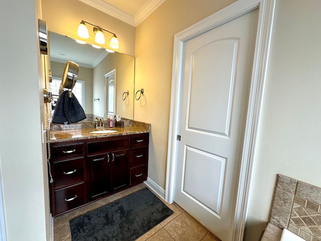 bathroom with tile patterned floors, ornamental molding, and vanity