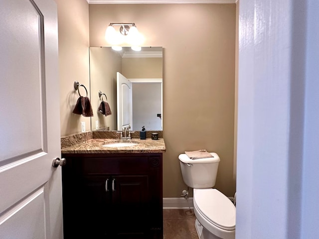 bathroom with vanity, tile patterned floors, and toilet